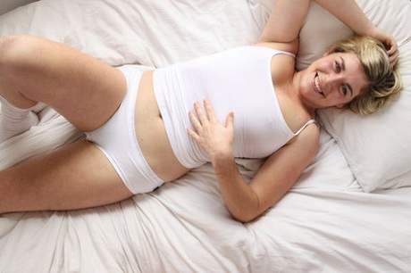 Authentic girlfriend Elayna shows her bush and toys it deeply with a glass dildo