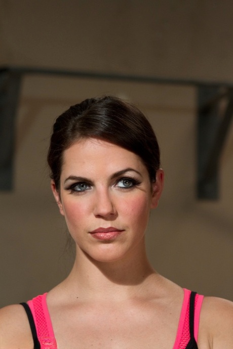 Attractive slim Bobbi Starr poses in a black outfit as Bella Wilde stretches topless