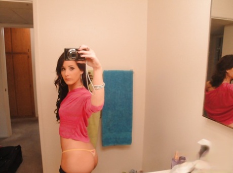 Barely legal young adult Mia Valentine taking natural mirror selfies while undressing