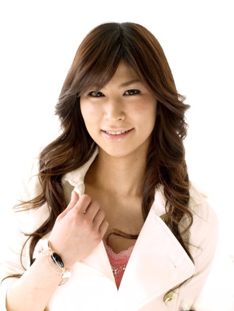 Clothed Japanese model Yuka Yamada shows her bare legs in a skirt