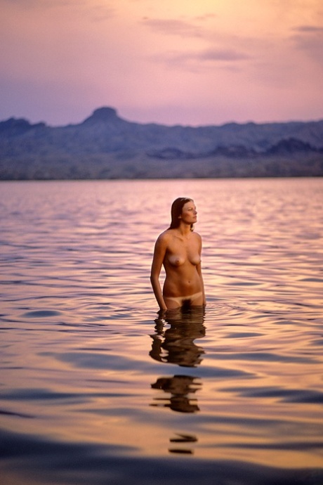 Tall natural Playboy muse Janice Raymond has fun posing artistic in wild