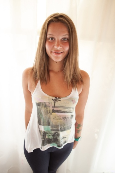 Innocent looking doll Liza Rowe teasing with her bubble butt and hairy femininity