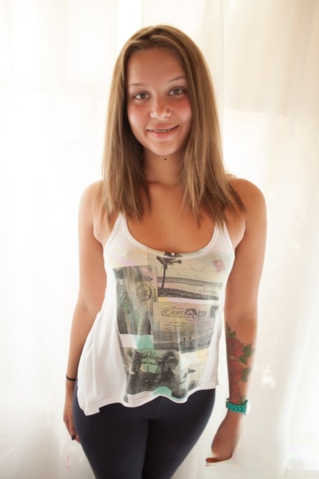 Innocent looking doll Liza Rowe teasing with her bubble butt and hairy femininity