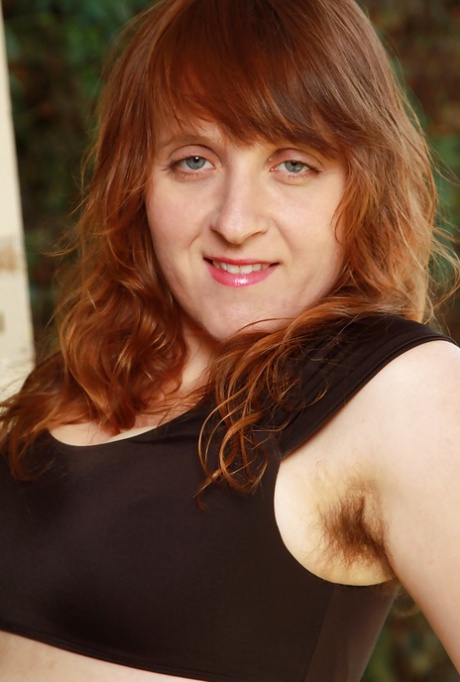 Ugly redhead woman Velma exposing her hirsute body outdoors