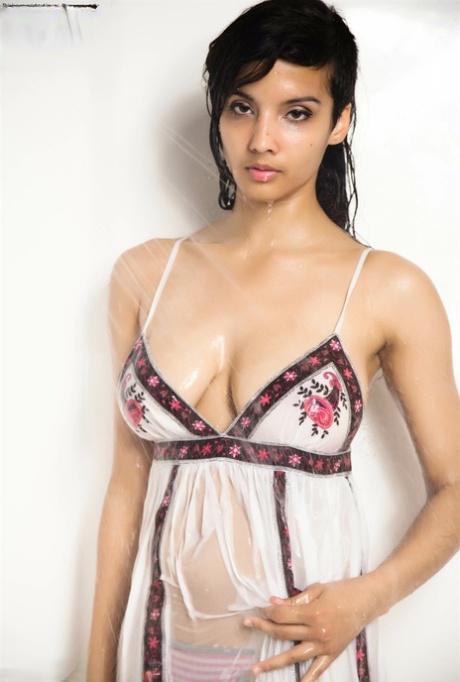 Indian solo girl takes off her wet dress to pose artistic in the bathtub