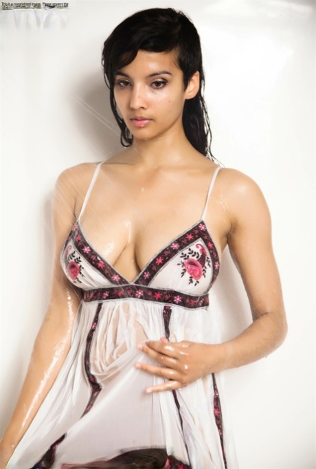 Indian solo girl takes off her wet dress to pose artistic in the bathtub