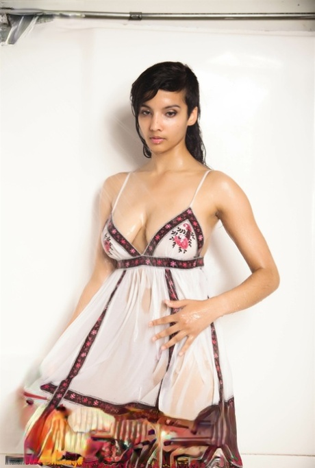 Indian solo girl takes off her wet dress to pose artistic in the bathtub