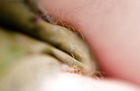 Redhead punk chick Isadora fondles all natural breasts and fingers hairy twat