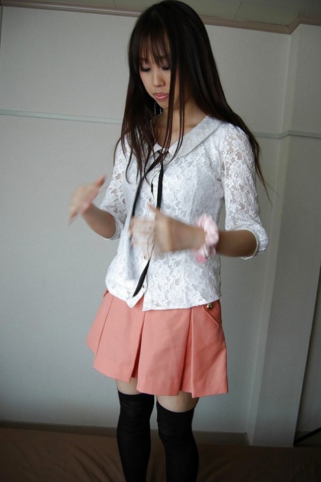 Smiley asian girl getting artistic and exposing hairy gash in close up