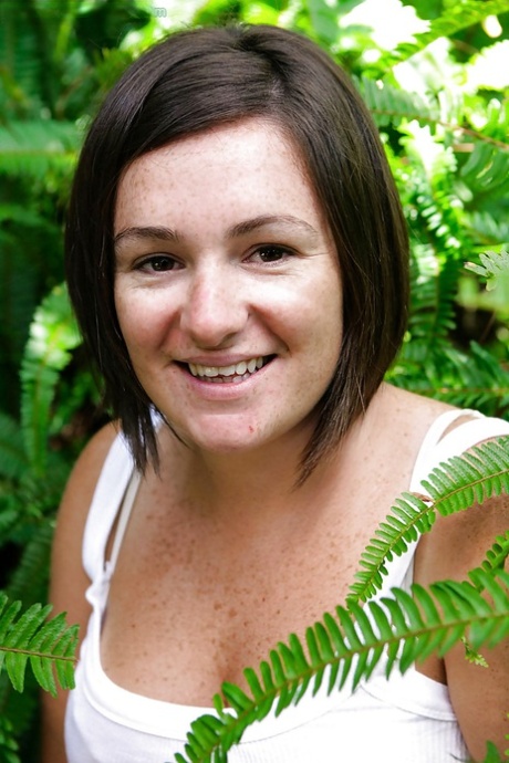 Chubby girl with freckles and big natural breasts spreads hairy cunt outside