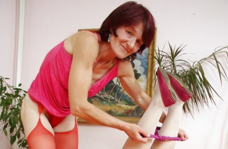 Mature lesbians in stockings spreading hairy vaginas for close ups