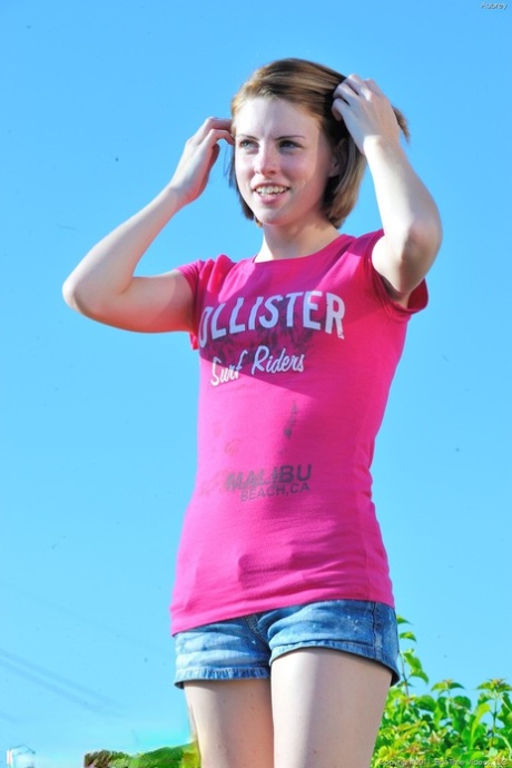 Sweet young adult Aubrey strips artistic and teases with her tiny breasts outdoors