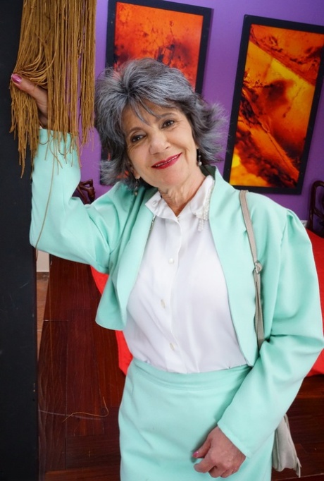 Naughty grandmother with great legs strips down to her bra and underwear