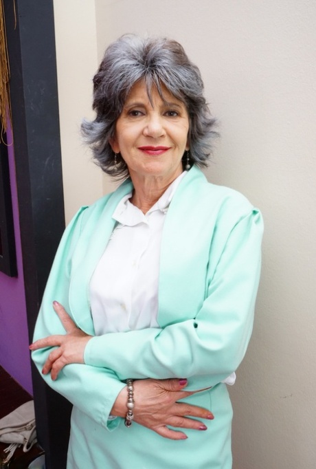 Naughty grandmother with great legs strips down to her bra and underwear