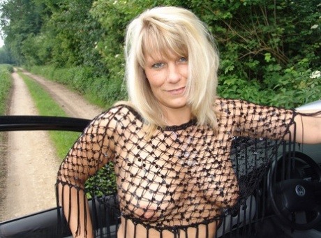 Mature woman Sweet Susi exposes herself in country lane wearing OTK boots
