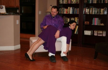 Dark haired girl Mackenzie Reed has her curves turned red during an OTK spanking