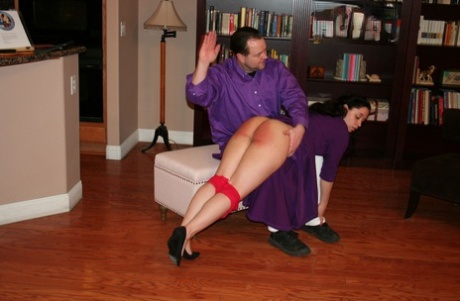 Dark haired girl Mackenzie Reed has her curves turned red during an OTK spanking