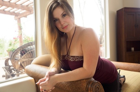 Big tit Danielle tries out some new intimacy toys on the sofa