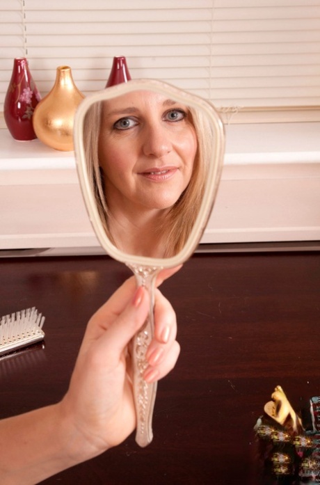 Mature authentic Tonya strips to her stockings, fondles her breasts & spreads wide