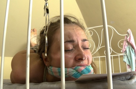 Alluring 18 year old Roxy Bell endures rough double penetration BDSM gangbang