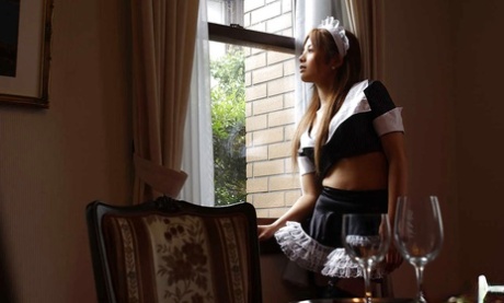Adorable asian maid Yuka Hata revealing her lacy lingerie