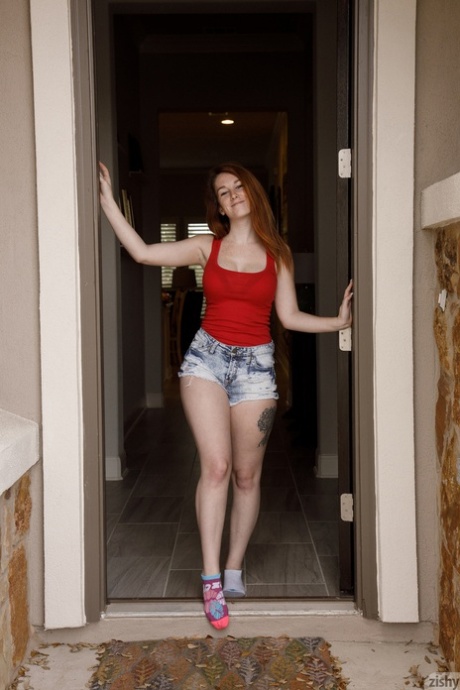 Natural redhead Ruby Corbett strips to her bra and panties at home