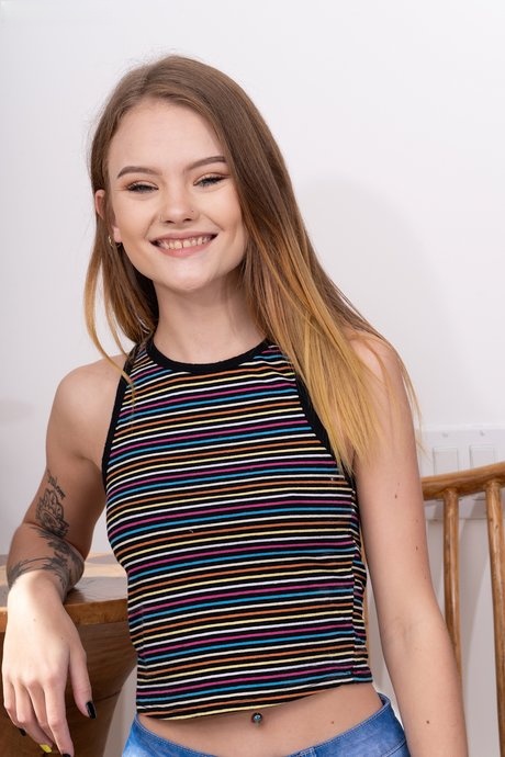 Slim young adult Dani Lynn poses artistic & shows attractive tiny breasts & trimmed twat in a cafe