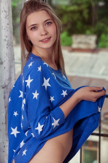 Alluring young adult Sigrid shows her alluring curves and her lickable shaved femininity