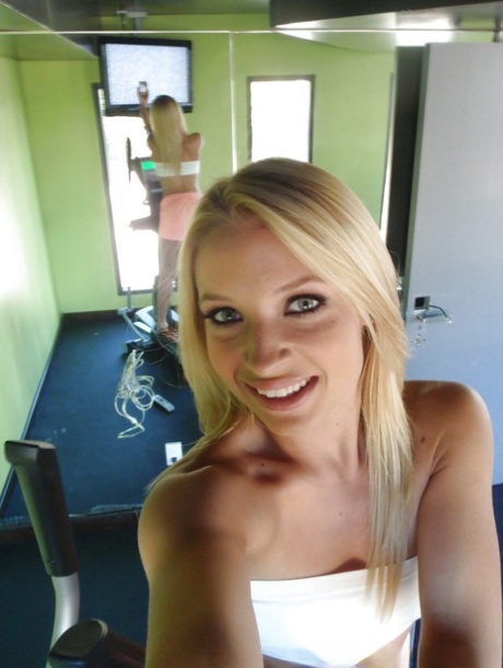 Attractive blonde teenager Alyssa taking alluring non artistic self shots at home