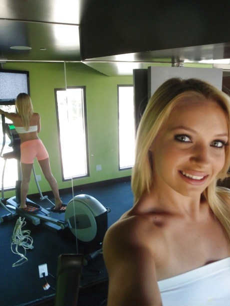 Attractive blonde teenager Alyssa taking alluring non artistic self shots at home