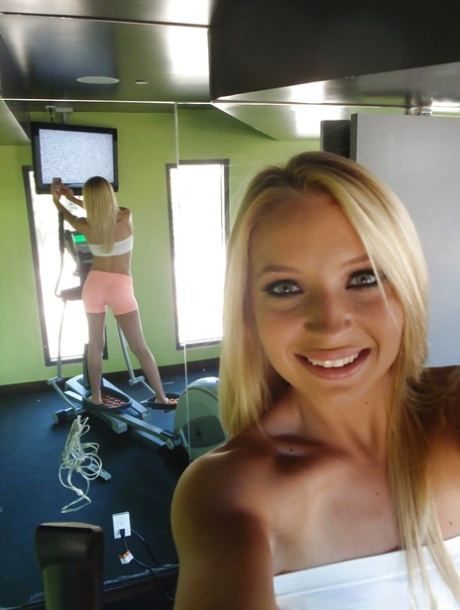 Attractive blonde teenager Alyssa taking alluring non artistic self shots at home