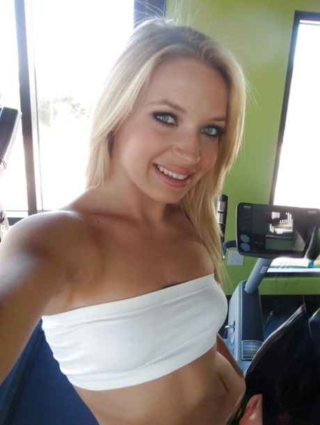 Attractive blonde teenager Alyssa taking alluring non artistic self shots at home