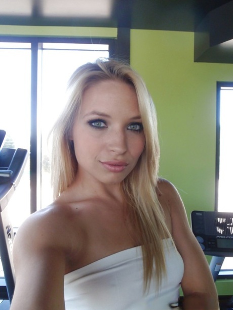 Attractive blonde teenager Alyssa taking alluring non artistic self shots at home