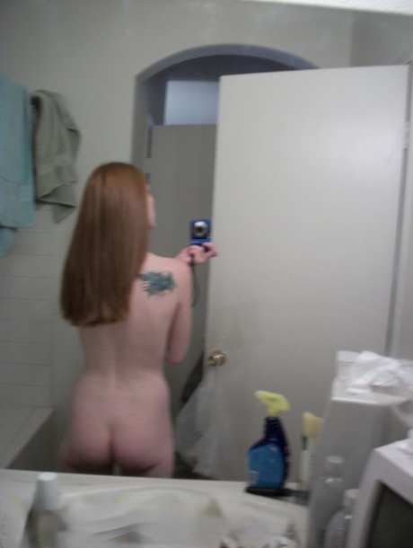 Ginger authentic Emily takes selfies of her natural young adult body in the mirror