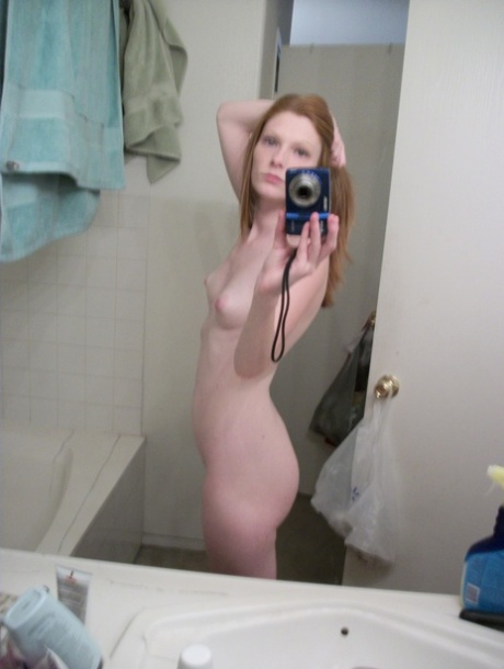 Ginger authentic Emily takes selfies of her natural young adult body in the mirror