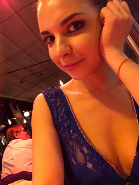 Russian young adult Alina Henessy takes artistic and non artistic selfies during the day