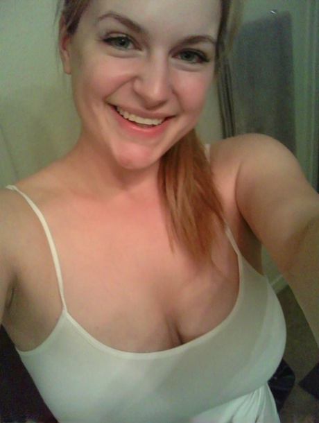 Blonde girl takes non artistic selfies in various places around her house