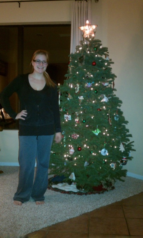 Blonde girl takes non artistic selfies in various places around her house