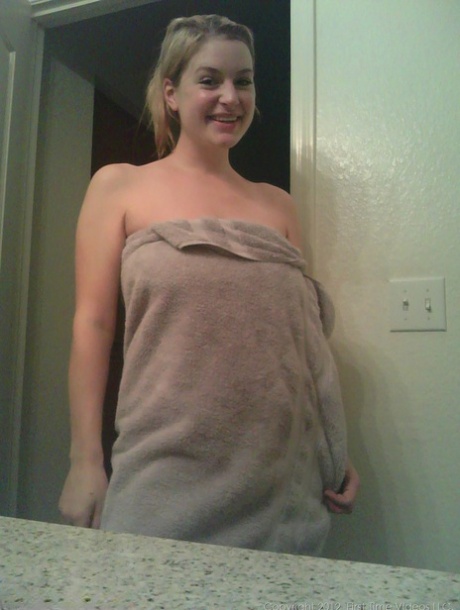 Blonde girl takes non artistic selfies in various places around her house