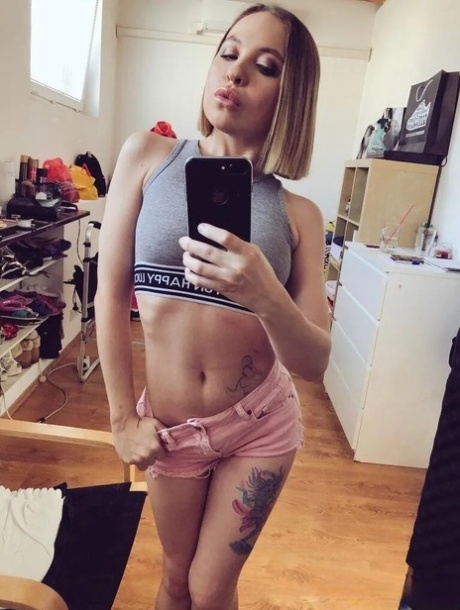 Alluring redhead takes artistic selfies showing her lovely breasts & her perfect curves