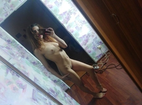 Beautiful babe posing natural and touching herself in front of the mirror