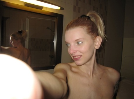 Skinny authentic shows her sweet breasts while taking artistic selfies in the mirror