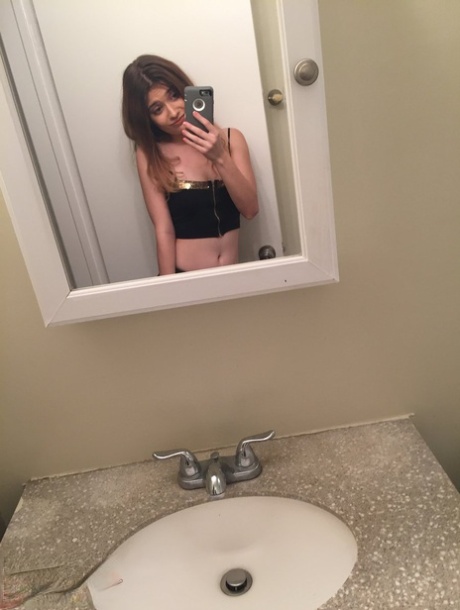 Petite young adult Ariel Mc Gwire makes her artistic modeling debut in bathroom selfies