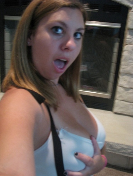 Dirty authentic young adult Nikki Morgan flaunts her cleavage in intimacy self shot photos