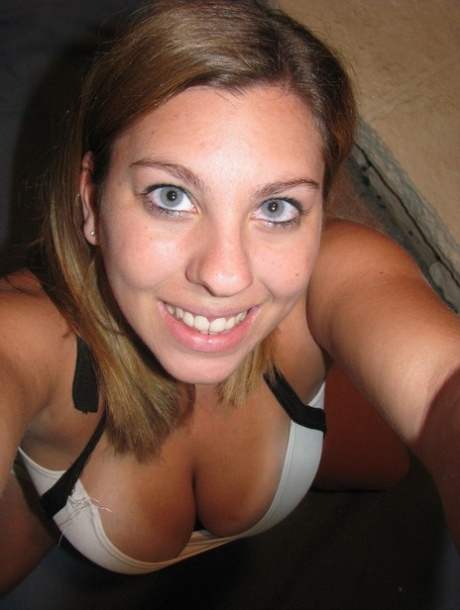 Dirty authentic young adult Nikki Morgan flaunts her cleavage in intimacy self shot photos