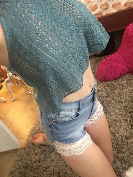 Nerdy chick Amber Hahn snaps off selfies while flashing her artistic body parts