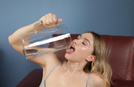 Naughty blonde Sunshine toys with a big dildo in a sizzling piss play solo