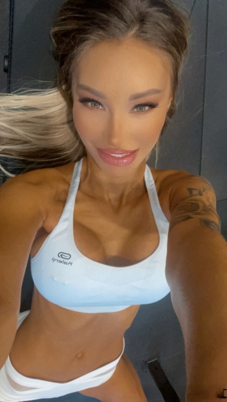 Petite babe Monika Fox shows off her big boobs with pierced nipples at the gym