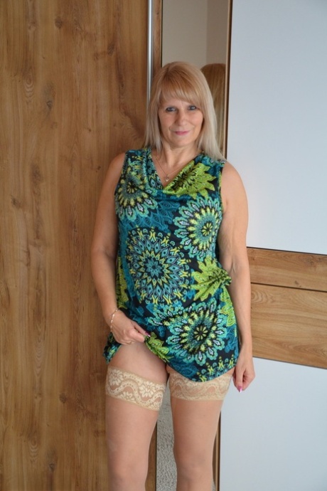 Middle-aged blonde Sweet Susi shows her tits and cunt both indoors and outside