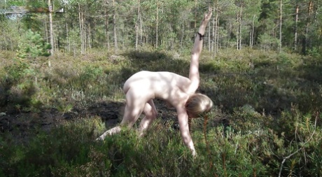 Outdoor posing with marvelous teen babe showing her ass in woods